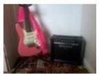 electric guitar and amp pink it also as strap and stand....